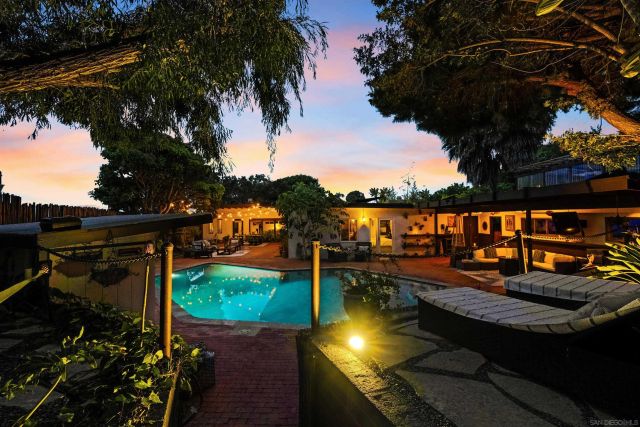 a view of a patio with furniture and wooden floor