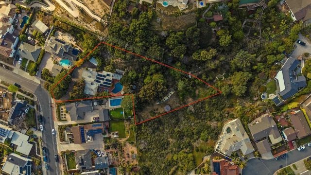 a view of a chairs and table in patio with wooden fence
