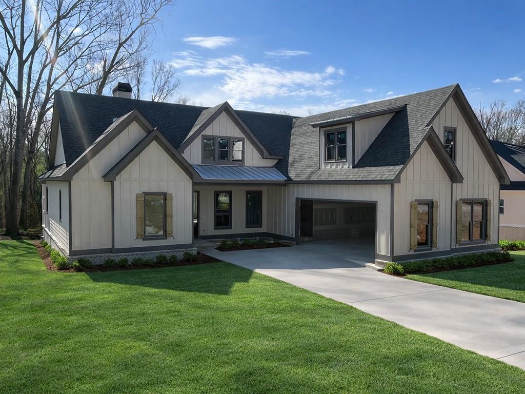 189 Pope Drive Canton, GA 30114 - Photo 1 of 20 a front view of a house with garden