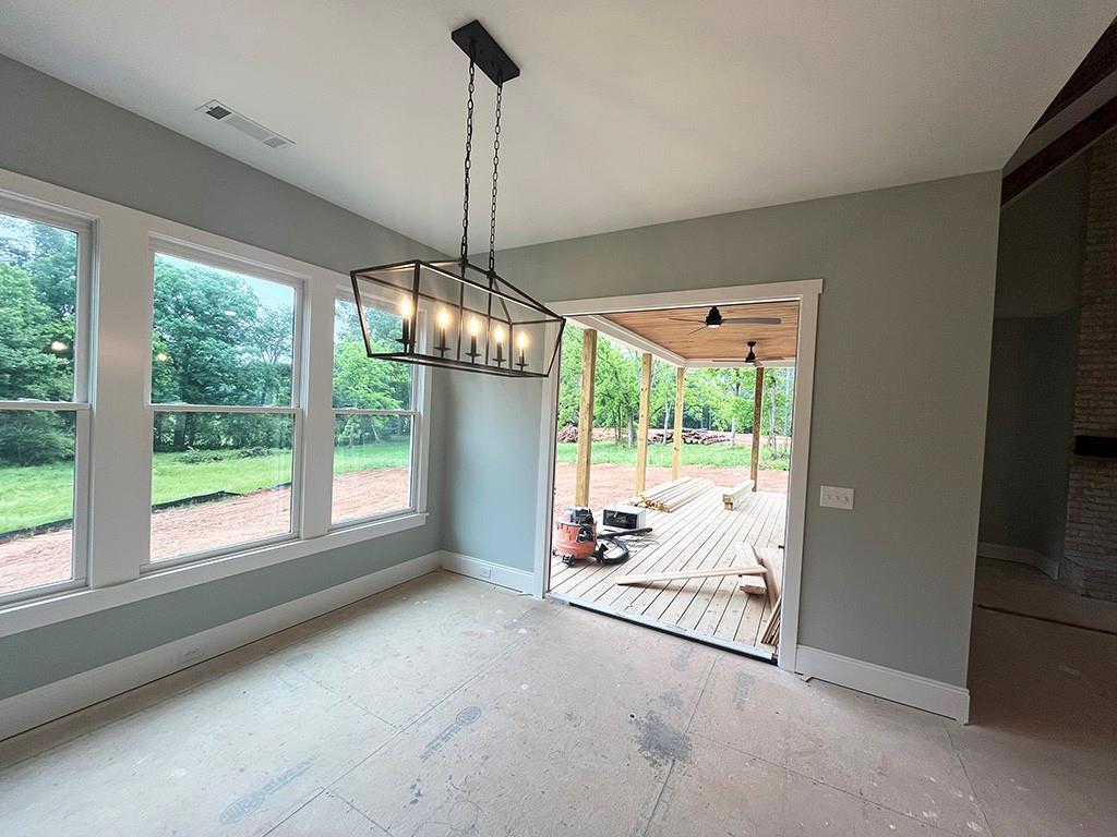189 Pope Drive Canton, GA 30114 - Photo 11 of 20 a view of an empty room with windows