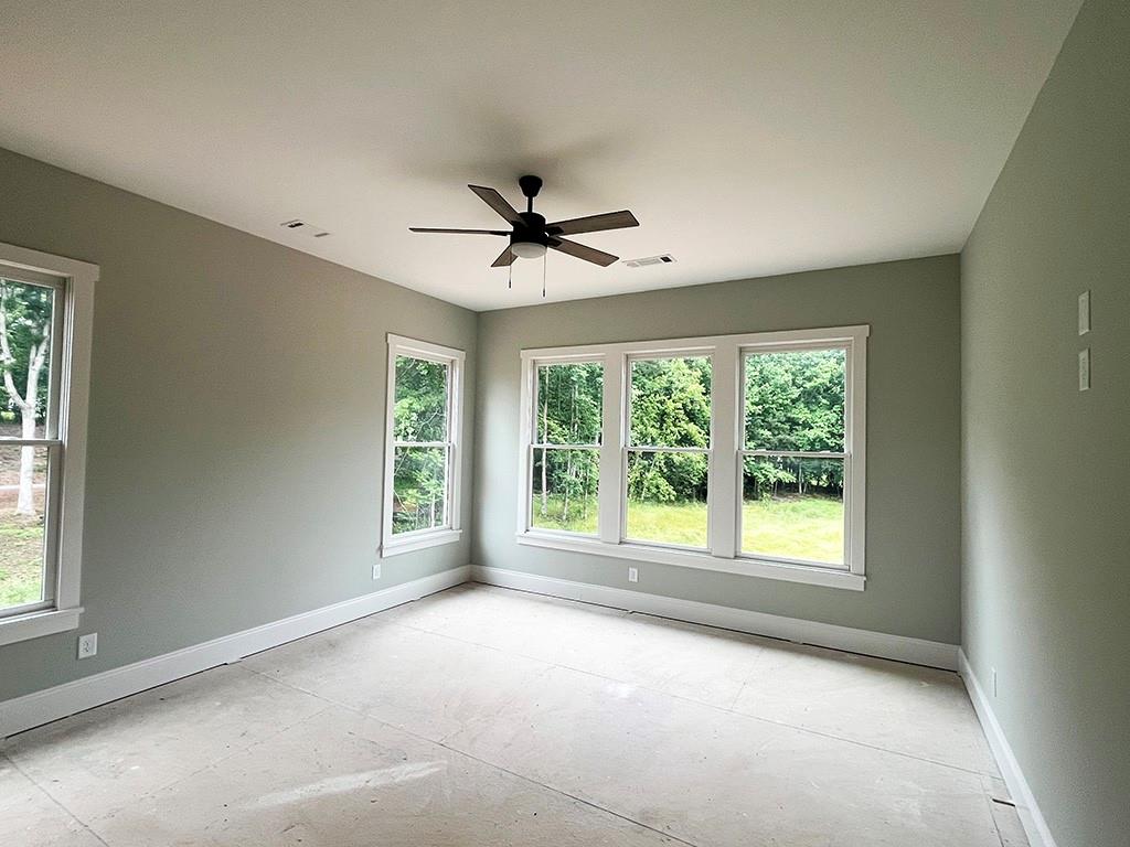 189 Pope Drive Canton, GA 30114 - Photo 12 of 20 a view of a livingroom with a ceiling fan and window