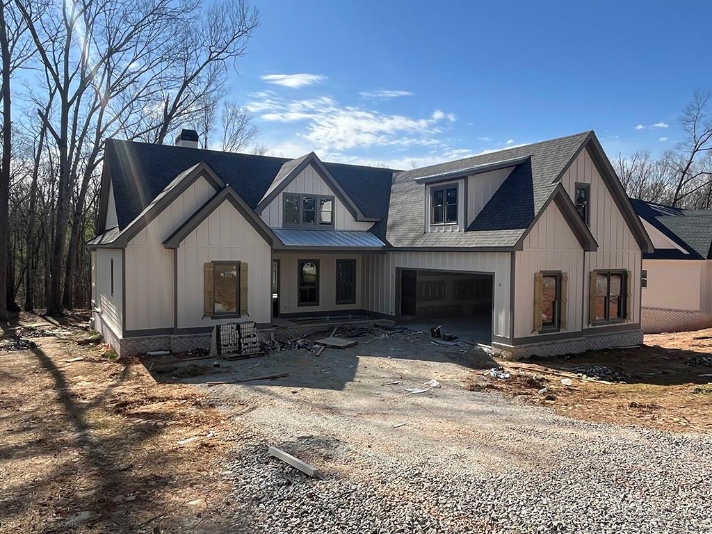 189 Pope Drive Canton, GA 30114 - Photo 3 of 20 a front view of a house with a yard