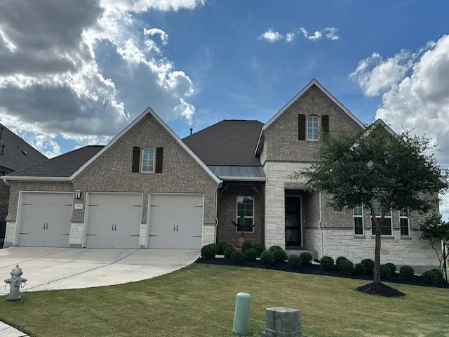 a front view of a house with a yard