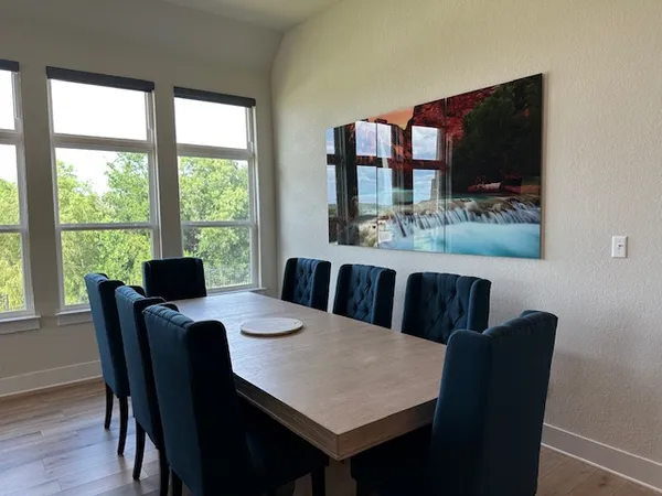 a view of a dining room with furniture window and outside view