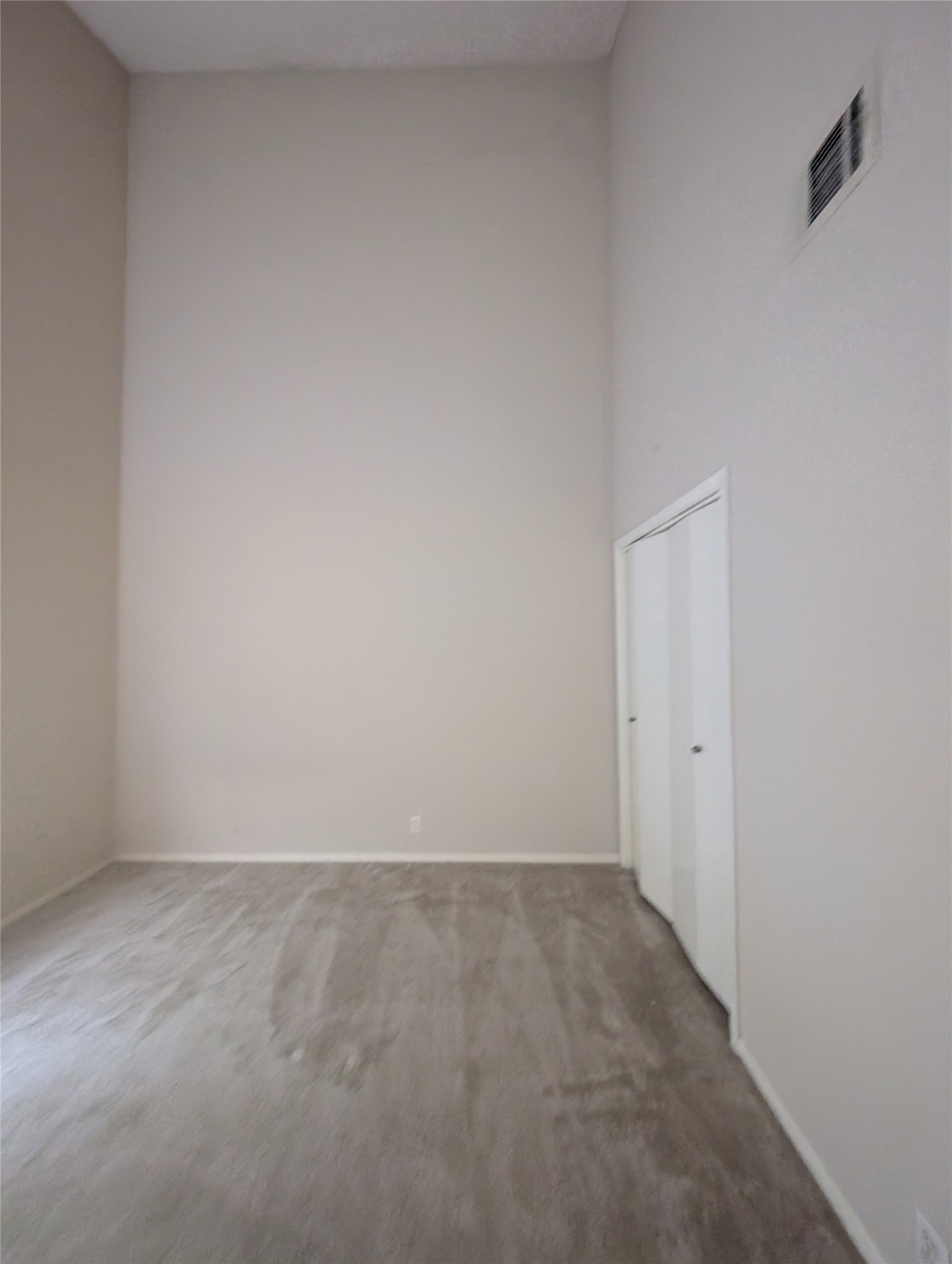 1653 Prairie Mark Lane Houston, TX 77077 - Photo 17 of 24 High ceilings and a neutral color scheme, with carpeted flooring. It includes a small closet with double doors. Ideal for a cozy bedroom or office space.