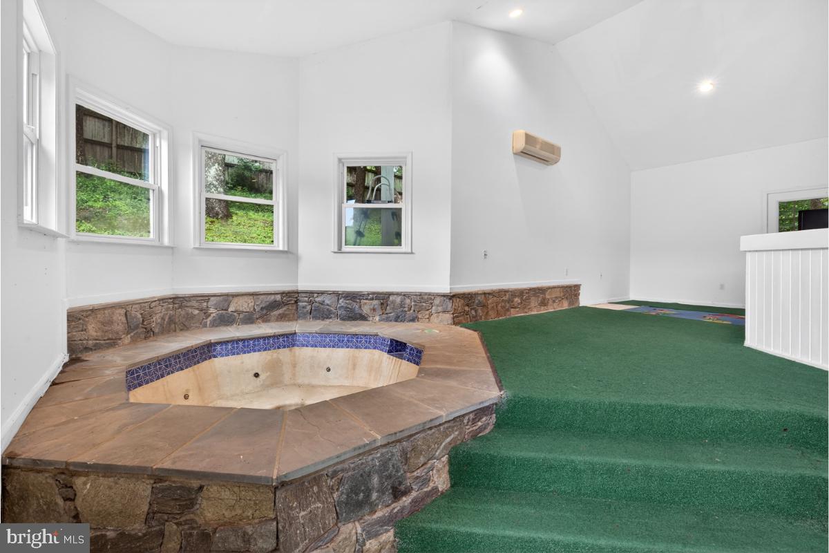 10320 Glen Road Potomac, MD 20854 - Photo 46 of 75 a bath tub sitting in a room next to a window