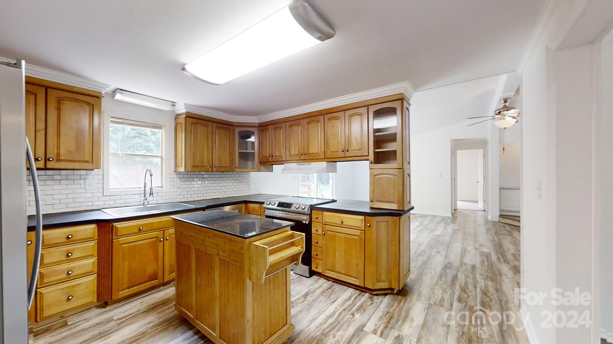 637 Hill Road Lincolnton, NC 28092 - Photo 15 of 26 a kitchen with stainless steel appliances granite countertop a stove and a sink