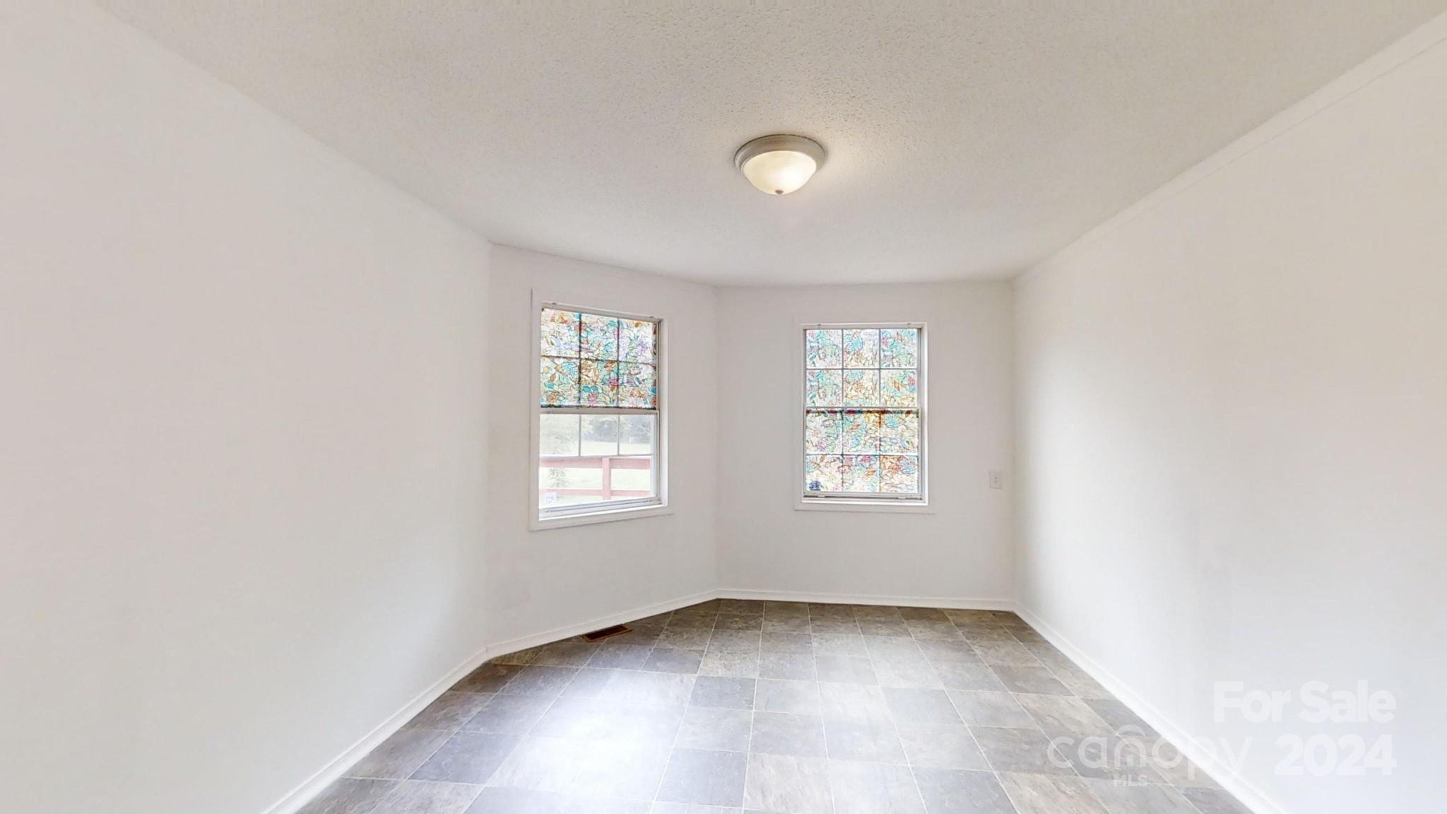637 Hill Road Lincolnton, NC 28092 - Photo 16 of 26 an empty room with windows