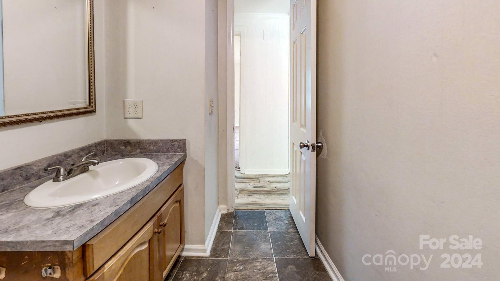 637 Hill Road Lincolnton, NC 28092 - Photo 19 of 26 a bathroom with a sink and a mirror