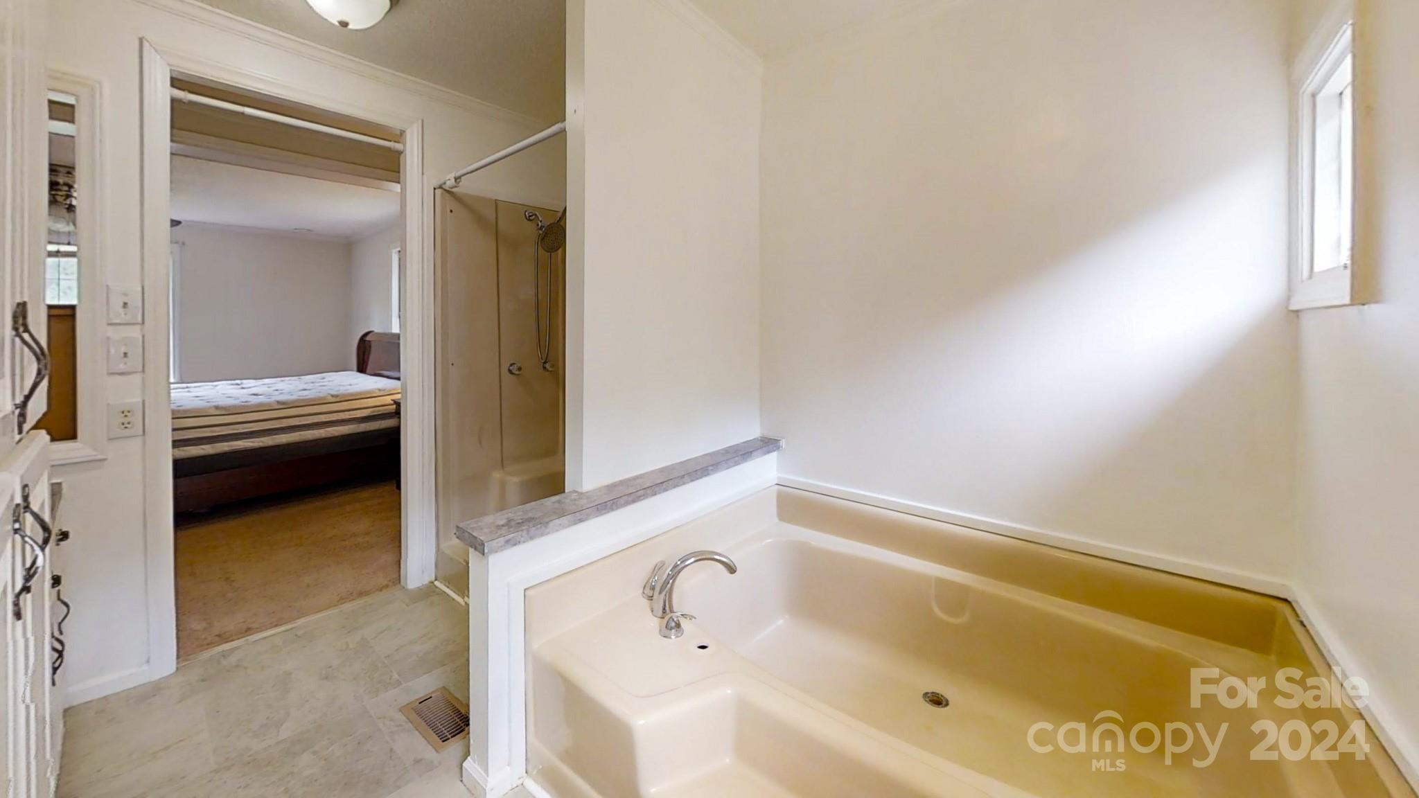 637 Hill Road Lincolnton, NC 28092 - Photo 20 of 26 a bathroom with a tub and sink