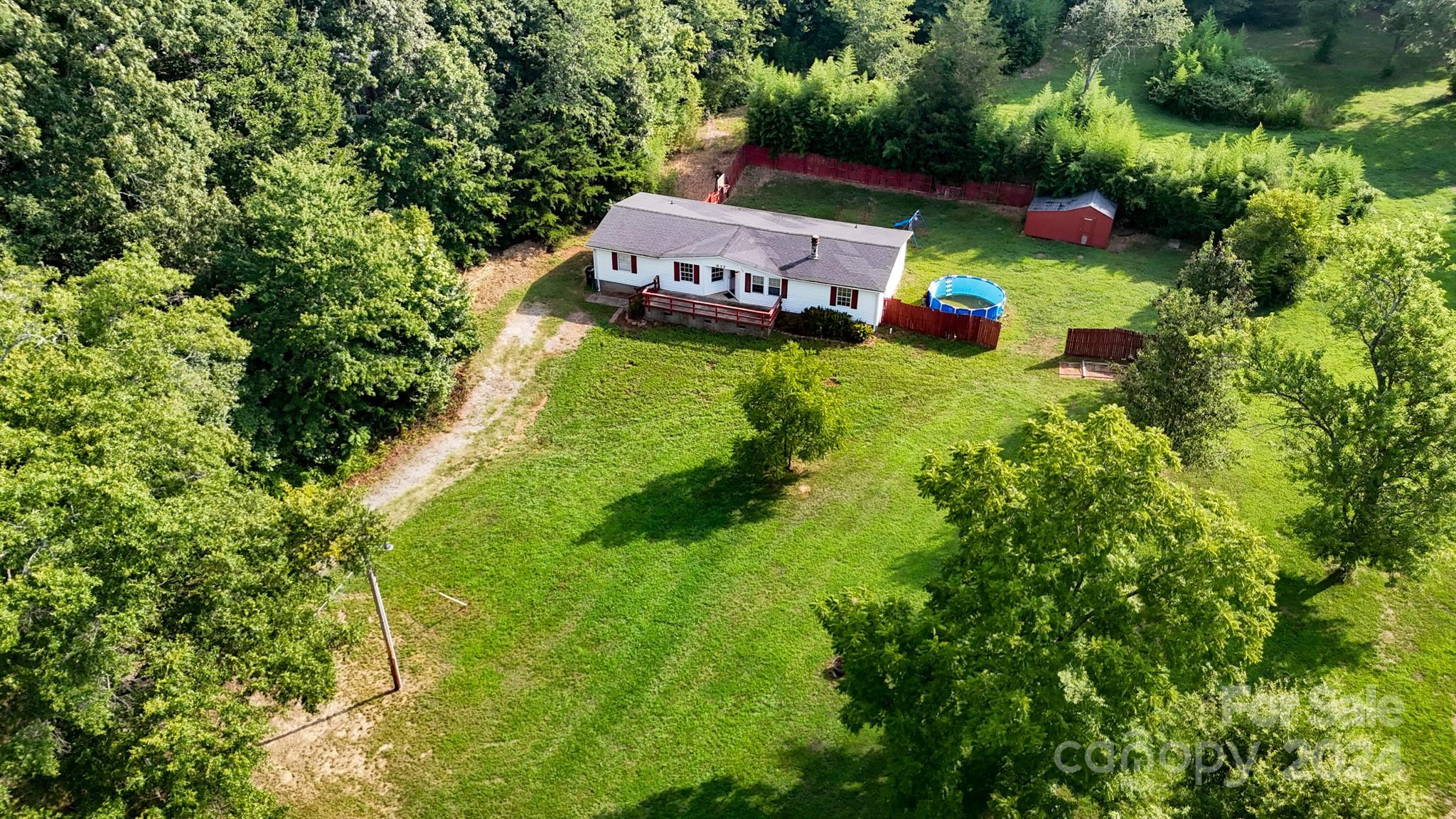 637 Hill Road Lincolnton, NC 28092 - Photo 3 of 26 a view of yard along with trees