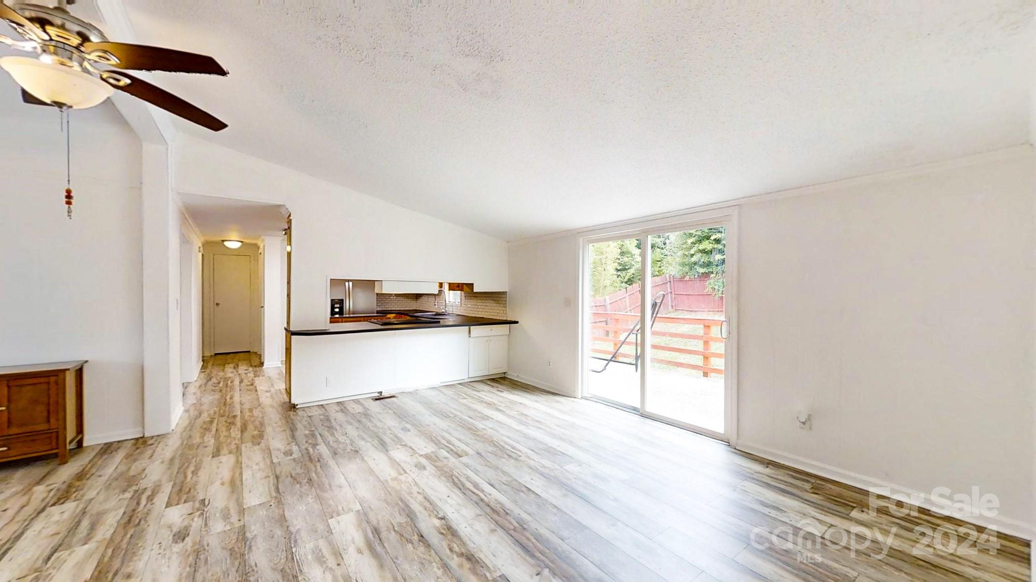 637 Hill Road Lincolnton, NC 28092 - Photo 10 of 26 a view of kitchen with wooden floor electronic appliances and window