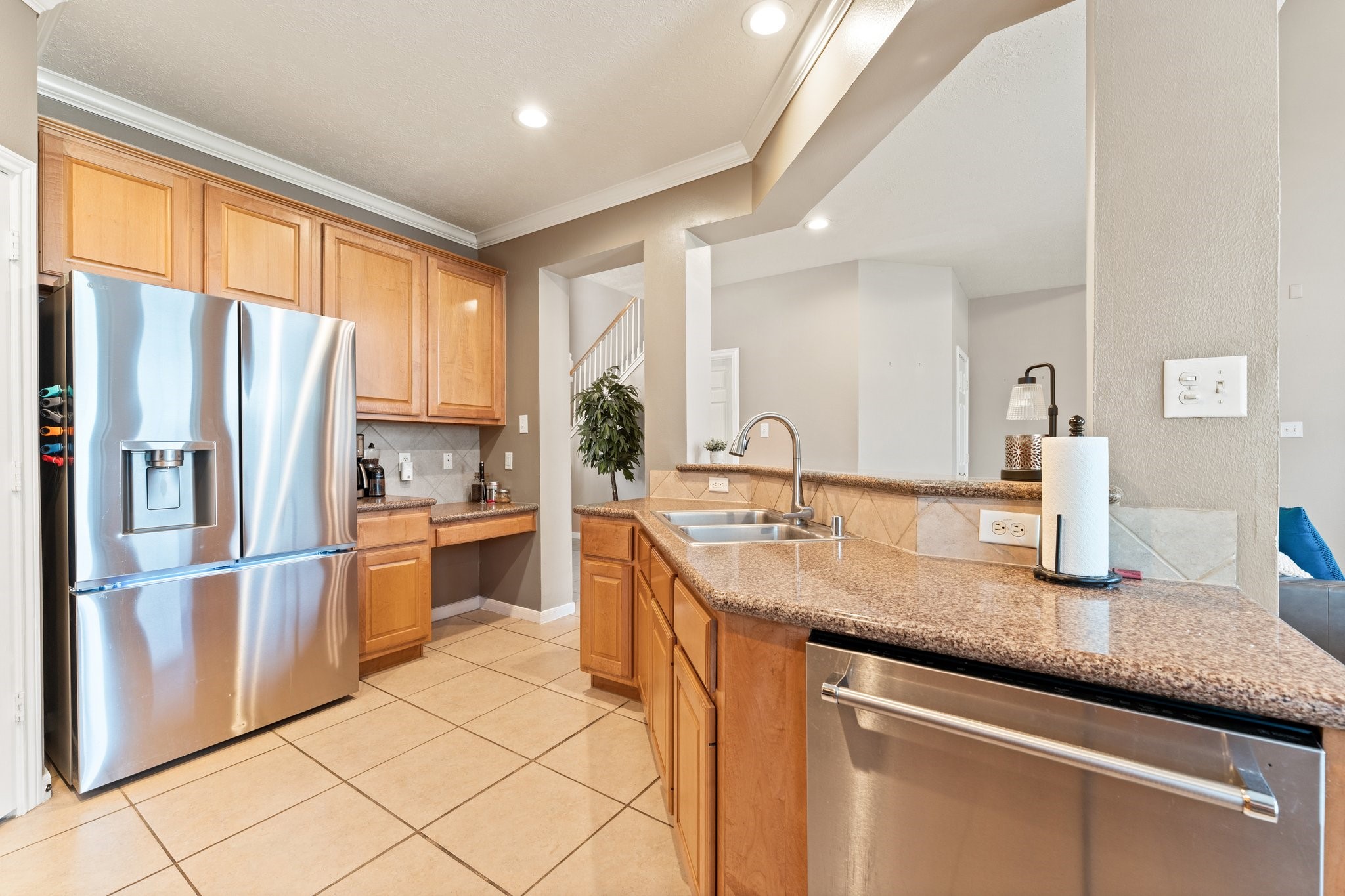 25447 China Springs Spring, TX 77373 - Photo 9 of 45 The kitchen features extensive granite counters, tile backsplash, crown molding, and plenty of cabinet space to store everything you could possibly need.