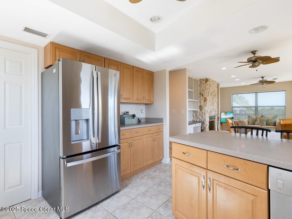 8820 44th Avenue Sebastian, FL 32958 - Photo 12 of 48 a kitchen with white cabinets and white appliances