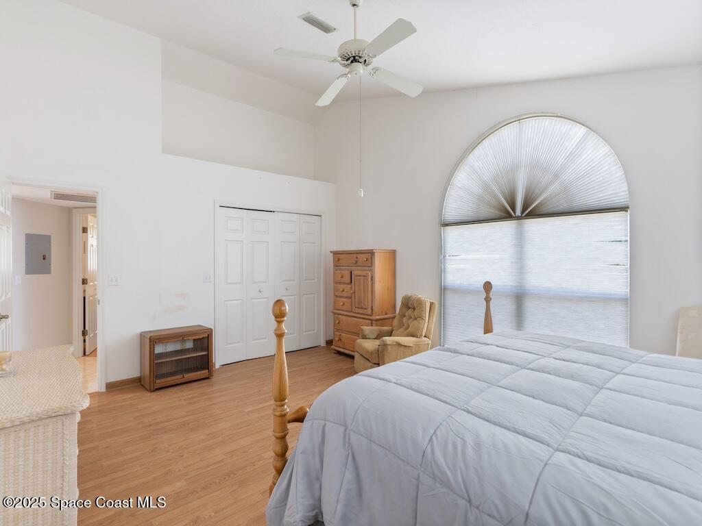 8820 44th Avenue Sebastian, FL 32958 - Photo 20 of 48 a bedroom with a bed and ceiling fan