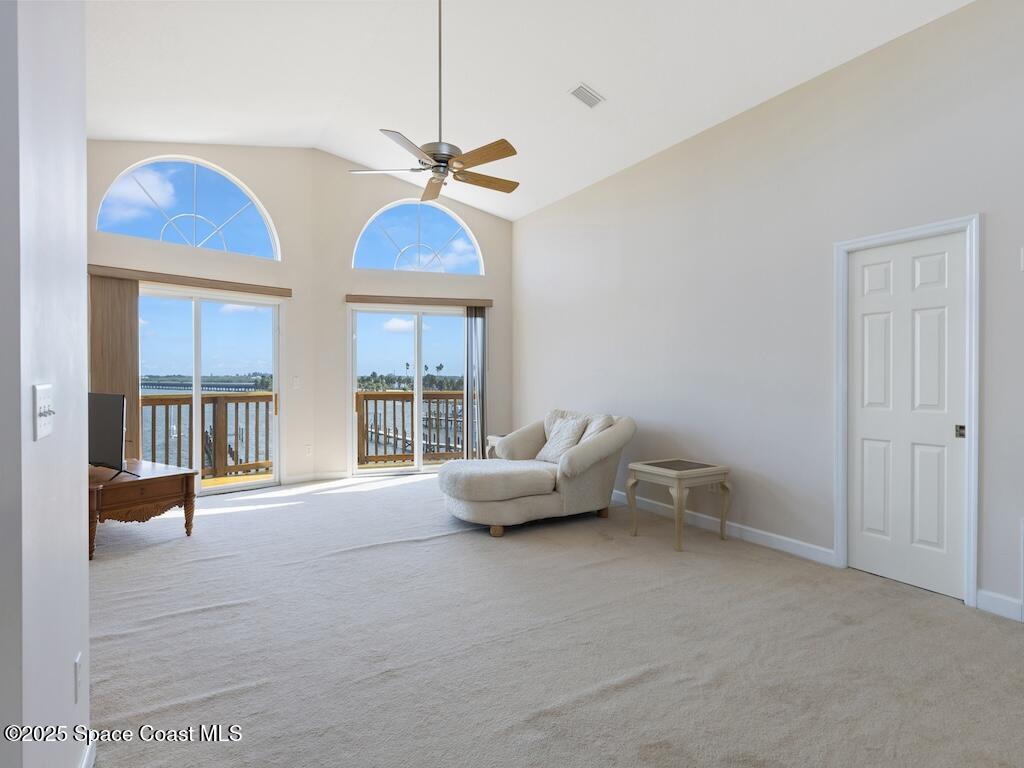 8820 44th Avenue Sebastian, FL 32958 - Photo 27 of 48 a living room with furniture and a chandelier