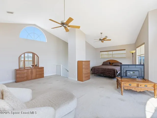 a bedroom with furniture and a window