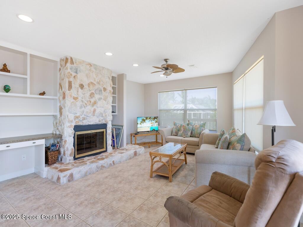 8820 44th Avenue Sebastian, FL 32958 - Photo 3 of 48 a living room with furniture and a fireplace