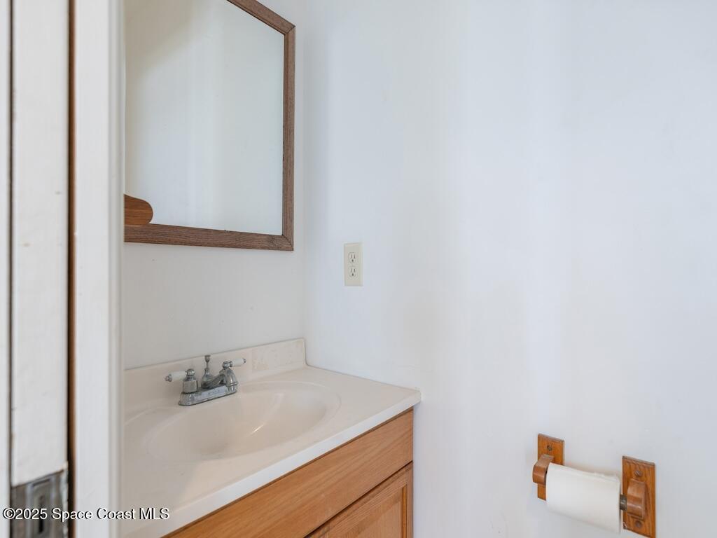 8820 44th Avenue Sebastian, FL 32958 - Photo 41 of 48 a bathroom with a sink and a mirror