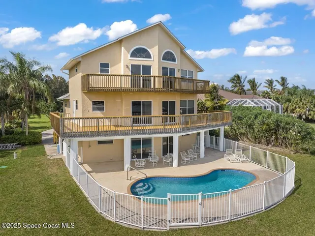 a view of a house with a swimming pool