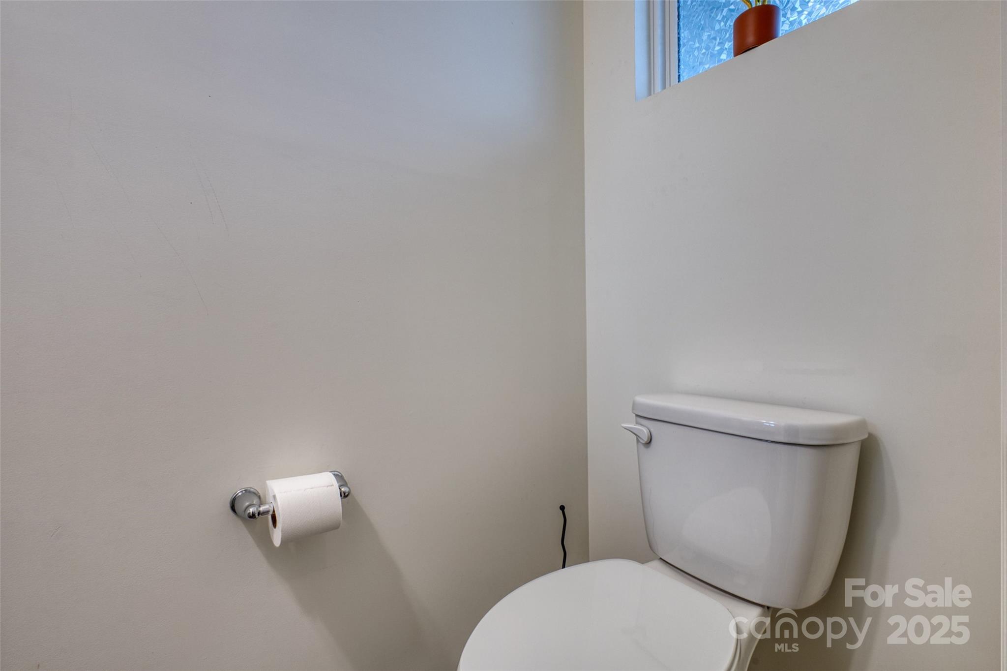 620 Candela Court York, SC 29745 - Photo 8 of 46 a white toilet sitting next to a white wall
