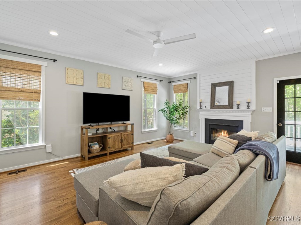 15418 Foxvale Way Midlothian, VA 23112 - Photo 12 of 50 a living room with furniture a flat screen tv and a fireplace