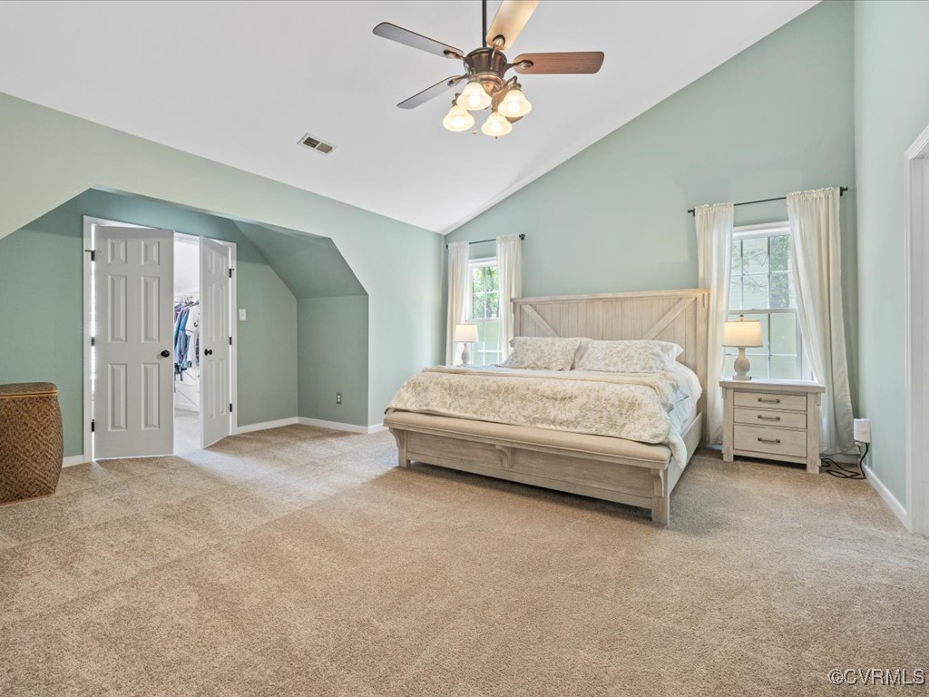 15418 Foxvale Way Midlothian, VA 23112 - Photo 19 of 50 a spacious bedroom with a bed and a chandelier