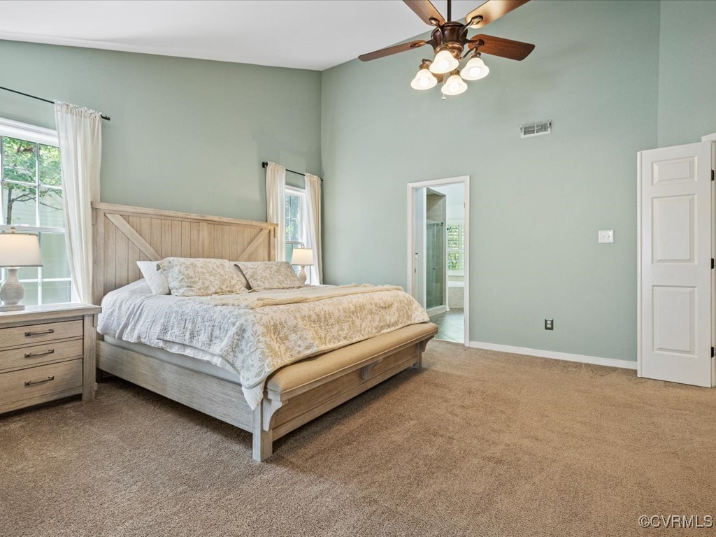 15418 Foxvale Way Midlothian, VA 23112 - Photo 21 of 50 a bedroom with a bed chandelier and a window