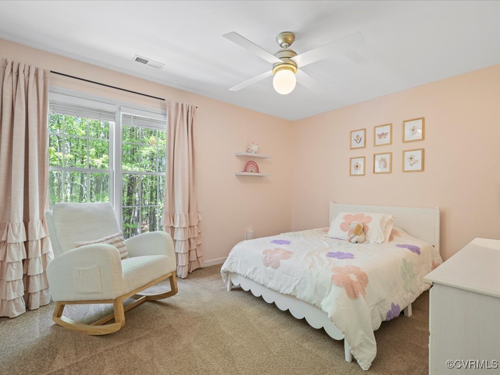 15418 Foxvale Way Midlothian, VA 23112 - Photo 24 of 50 a bedroom with a bed and a chandelier