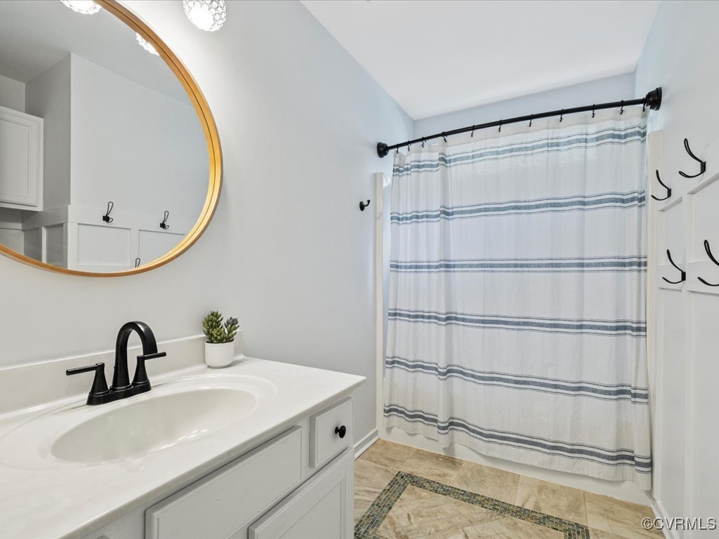 15418 Foxvale Way Midlothian, VA 23112 - Photo 27 of 50 a bathroom with a sink and a mirror