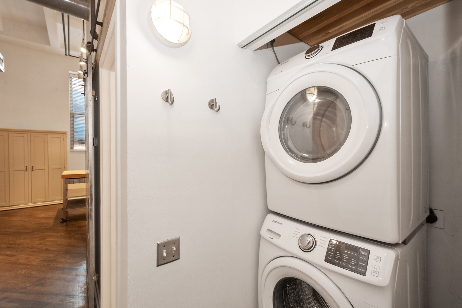 500 South Clinton Street, Unit 101 Chicago, IL 60607 - Photo 9 of 11 a view of storage and utility room with washer and dryer