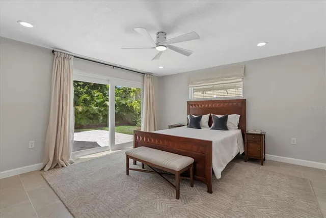 a bed sitting in a room next to a window