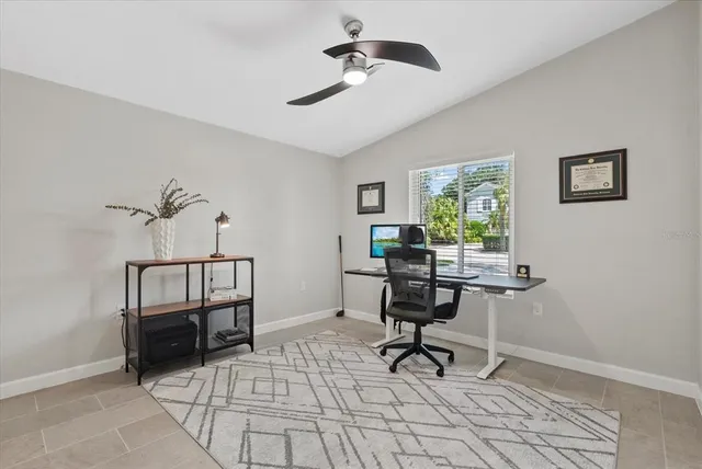 a view of a workspace with furniture