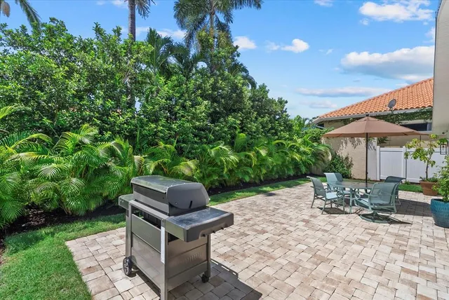 a view of a backyard with sitting area