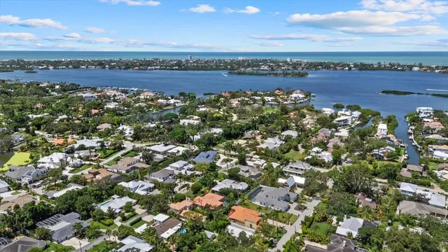 an aerial view of a house with a yard and garden