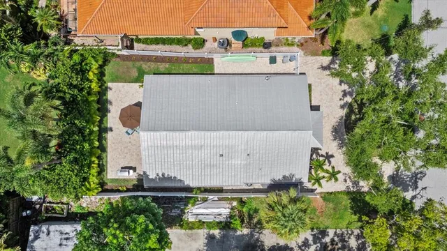 an aerial view of residential houses with outdoor space and street view