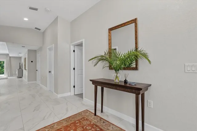 a vase of flowers sitting on a table
