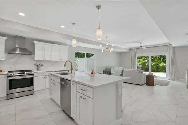 a kitchen with a sink stove and cabinets