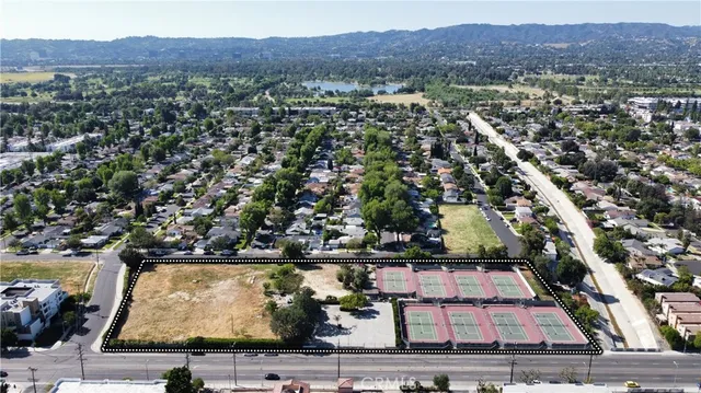 an aerial view of house with yard