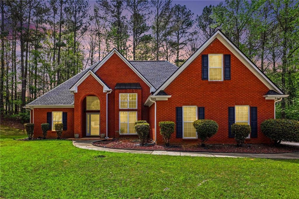 1041 Olive Drive Hampton, GA 30228 - Photo 1 of 29 a front view of a house with a yard and porch
