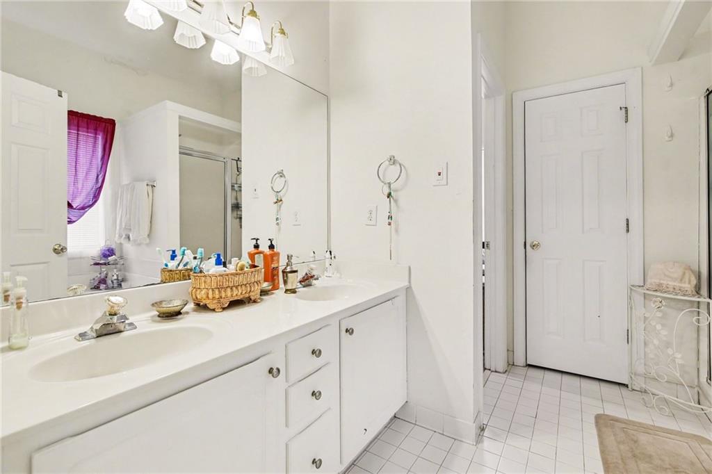 1041 Olive Drive Hampton, GA 30228 - Photo 16 of 29 a bathroom with a double vanity sink mirror and double