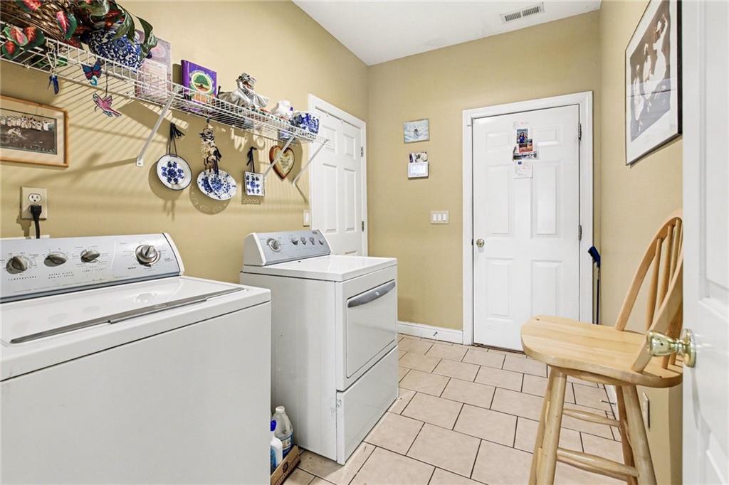 1041 Olive Drive Hampton, GA 30228 - Photo 19 of 29 a utility room with dryer and washer