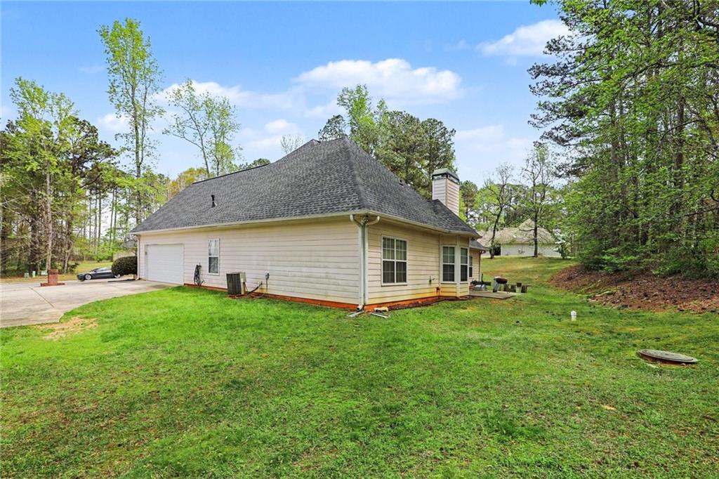 1041 Olive Drive Hampton, GA 30228 - Photo 25 of 29 a front view of house with yard and trees