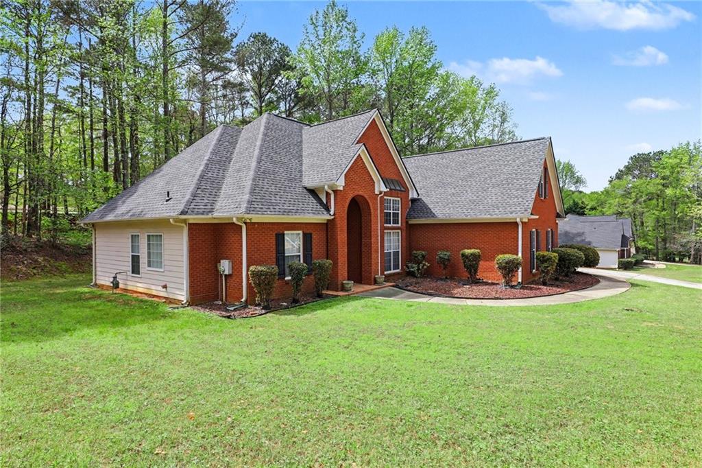 1041 Olive Drive Hampton, GA 30228 - Photo 3 of 29 a view of a house with a yard and sitting area