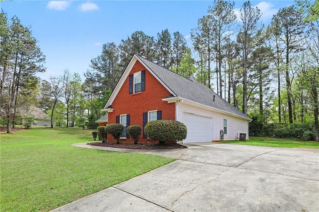 1041 Olive Drive Hampton, GA 30228 - Photo 4 of 29 a view of a house with a yard