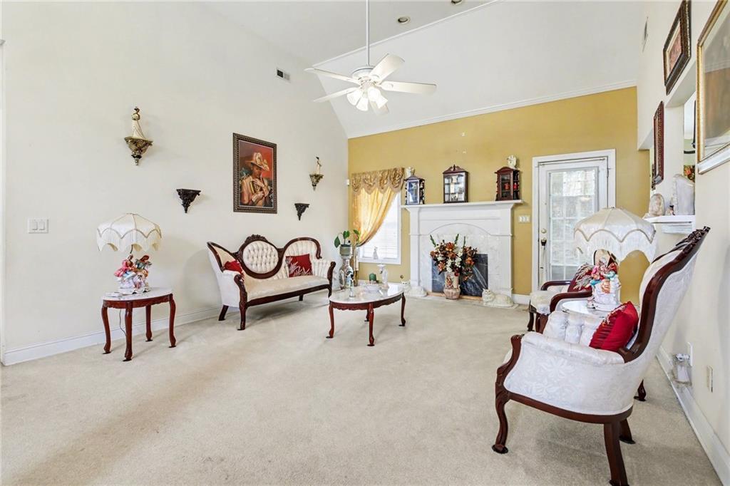 1041 Olive Drive Hampton, GA 30228 - Photo 6 of 29 a living room with furniture and a couch