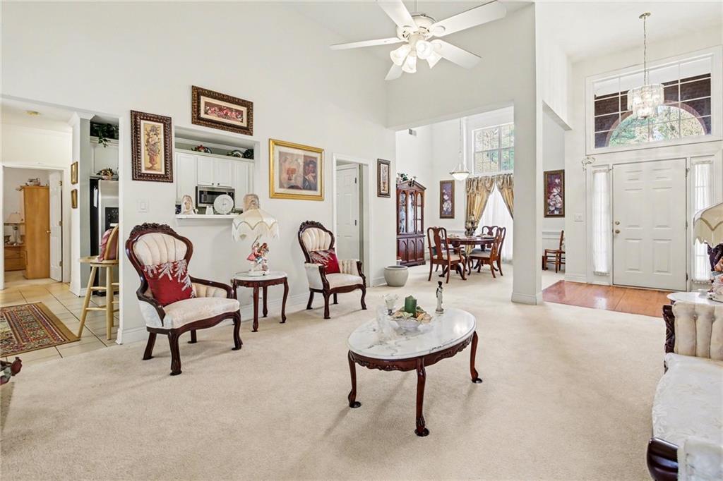 1041 Olive Drive Hampton, GA 30228 - Photo 7 of 29 a living room with furniture and wooden floor