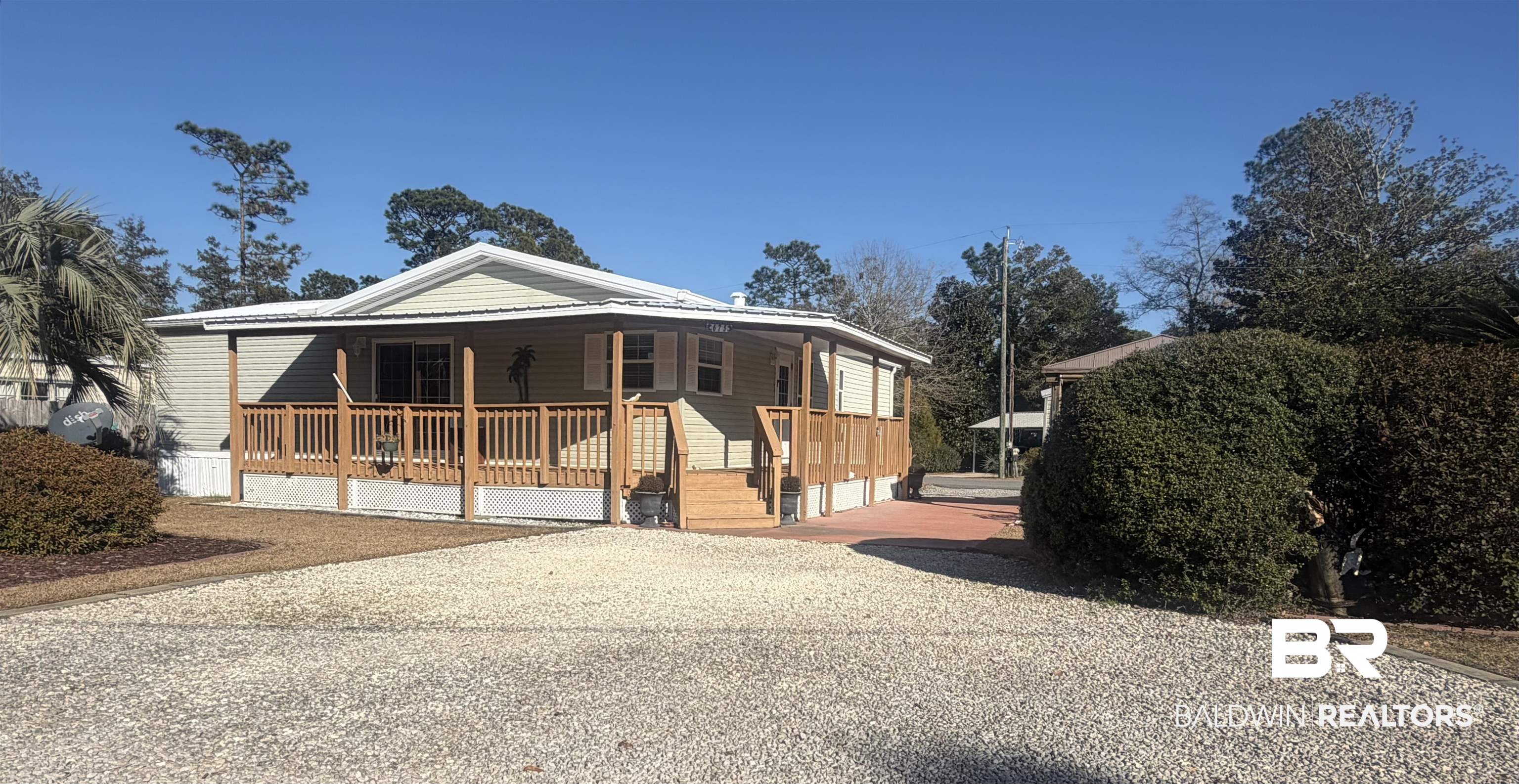 675 Escambia Loop Lillian, AL 36549 - Photo 2 of 44 View of front of house with a porch and driveway