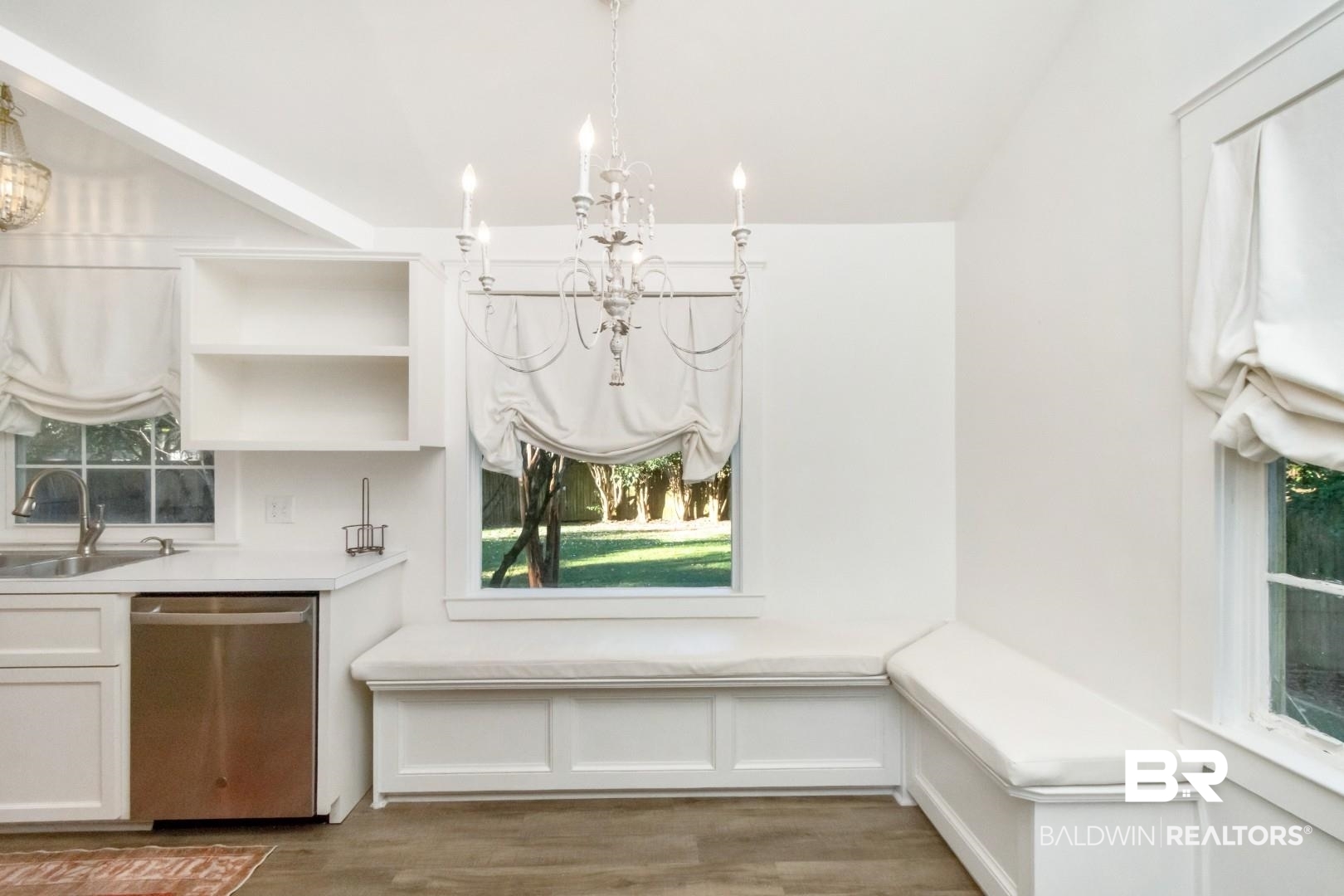 16 Princess Anne Road Mobile, AL 36608 - Photo 6 of 40 Unfurnished dining area featuring wood finished floors and a chandelier