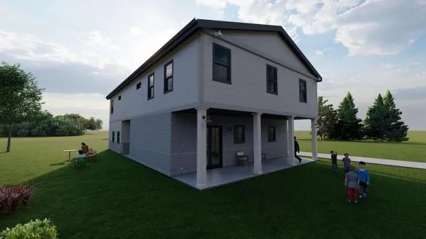 a view of an house with backyard and garden